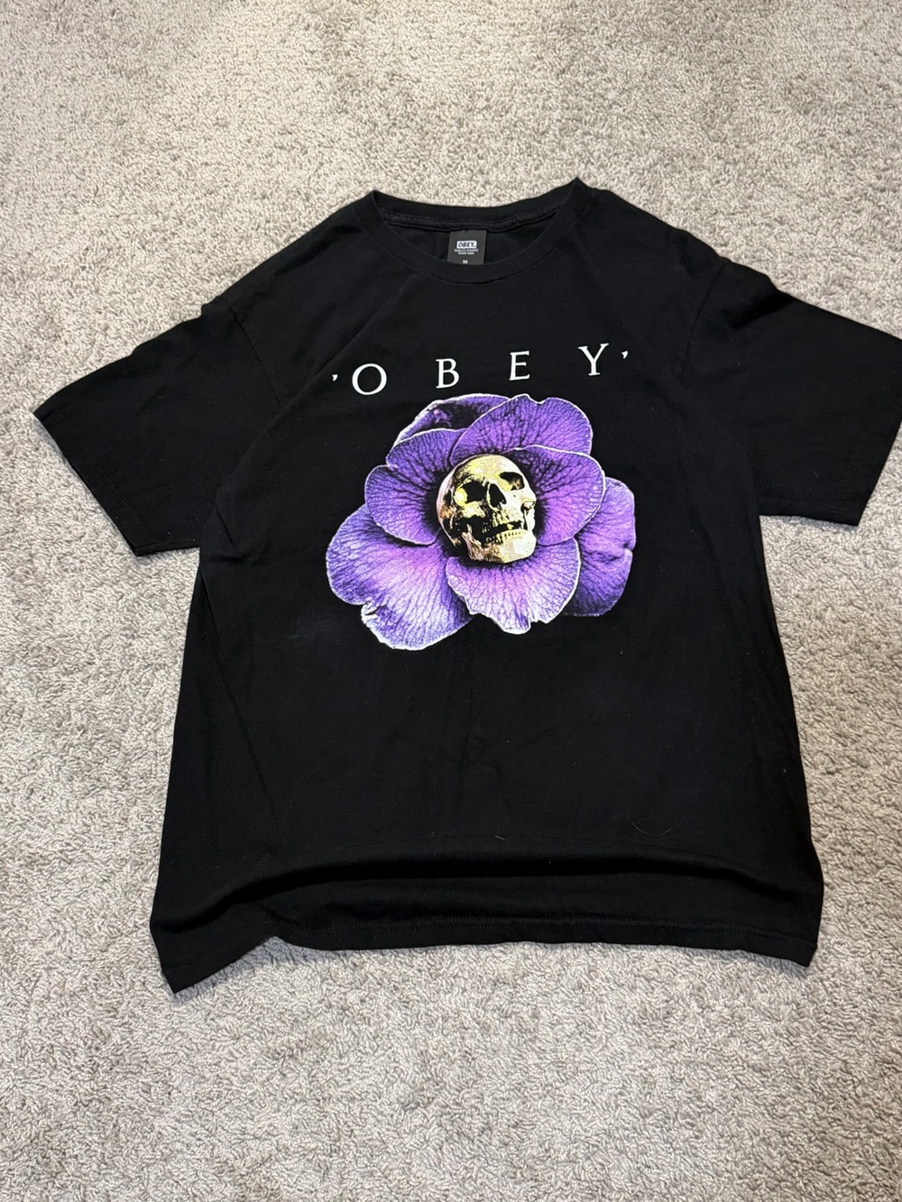 Obey Black Tee with Purple Flower and Gold Skull Graphic